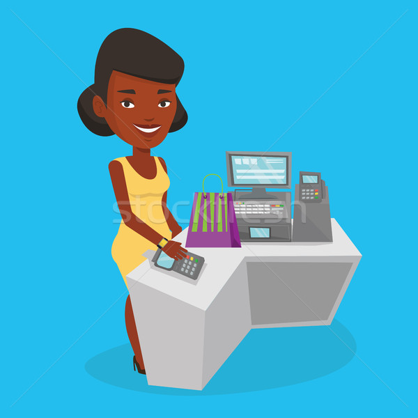 Woman paying wireless with smart watch. Stock photo © RAStudio
