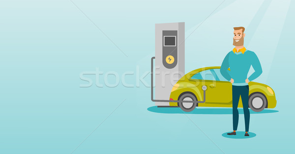 Samochód elektryczny młodych człowiek stacja stałego Zdjęcia stock © RAStudio