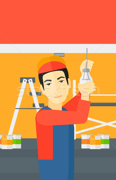 Electrician twisting light bulb. Stock photo © RAStudio