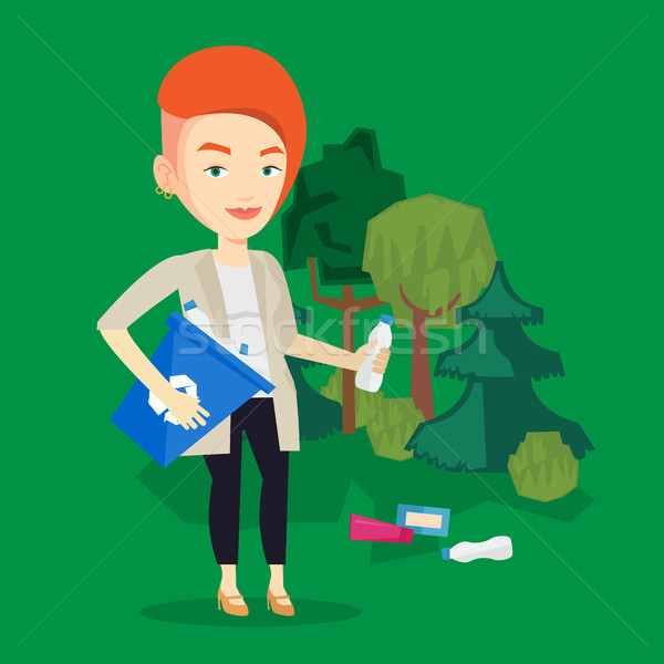 Woman collecting garbage in forest. Stock photo © RAStudio