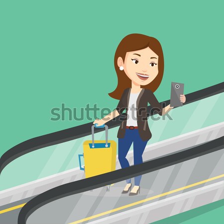 女性 スマートフォン エスカレーター 空港 立って 見える ストックフォト © RAStudio