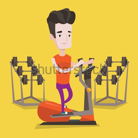 Man exercising on elliptical trainer. Stock photo © RAStudio
