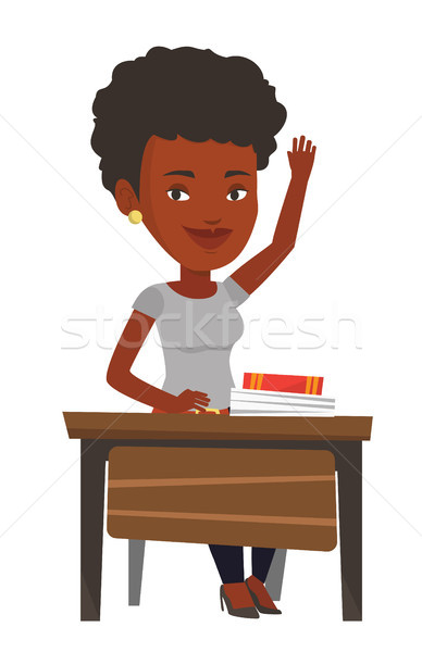 Stock photo: Student raising hand in class for an answer.