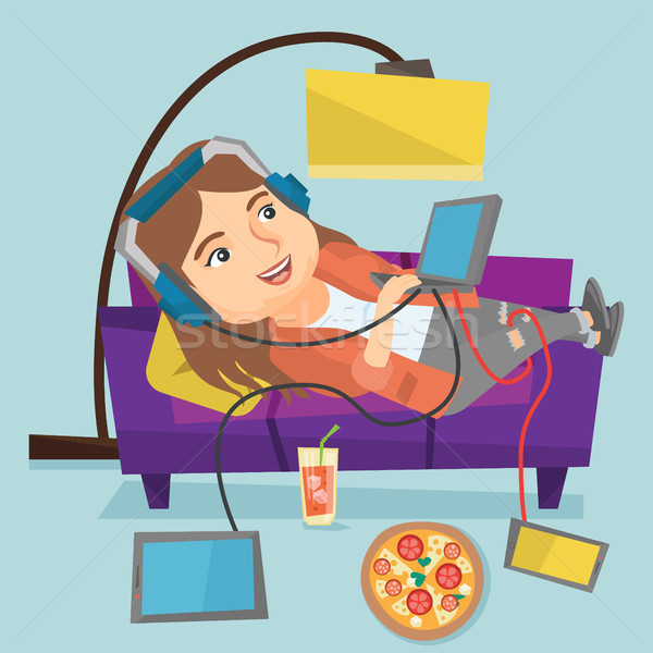 Caucasian fat woman lying on sofa with gadgets. Stock photo © RAStudio