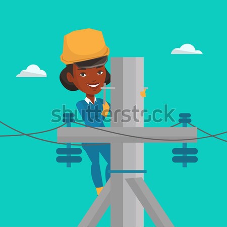 Electrician working on electric power pole. Stock photo © RAStudio