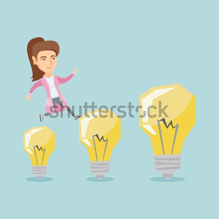 Business man jumping on light bulbs. Stock photo © RAStudio