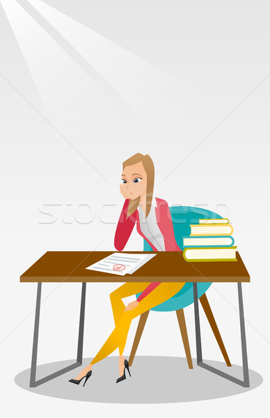 Sad student looking at test paper with bad mark. Stock photo © RAStudio