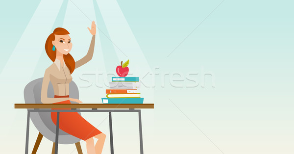 Student raising hand in class for an answer. Stock photo © RAStudio