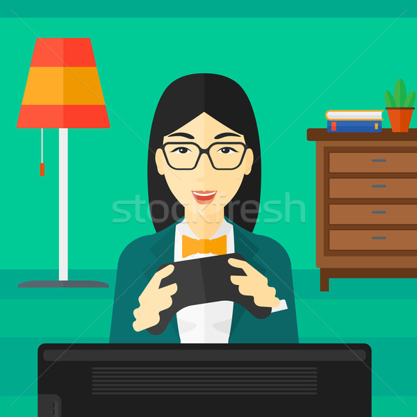 Woman playing video game. Stock photo © RAStudio