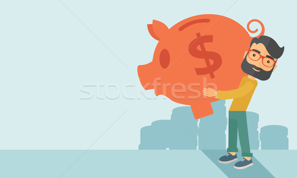 Man with his big piggy bank Stock photo © RAStudio