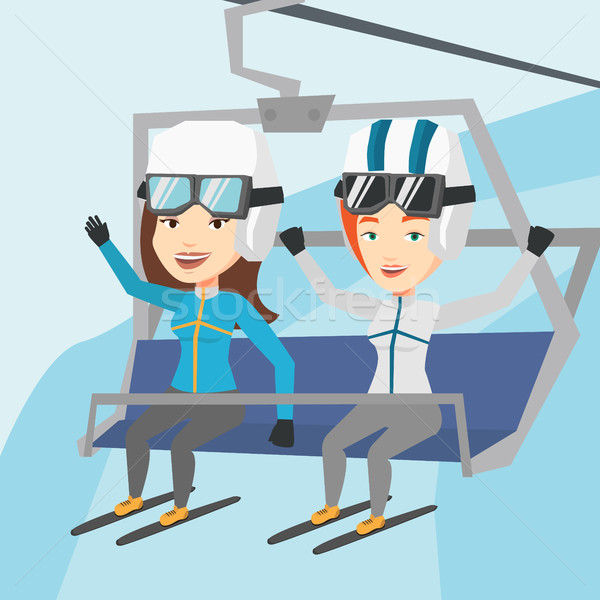 Stock photo: Two happy skiers using cableway at ski resort.