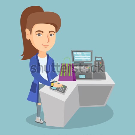Woman paying wireless with smart watch. Stock photo © RAStudio