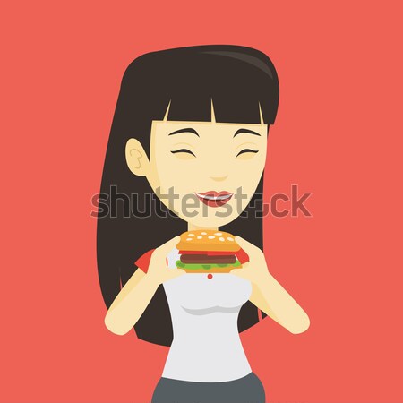 Donna mangiare hamburger asian gioioso Foto d'archivio © RAStudio