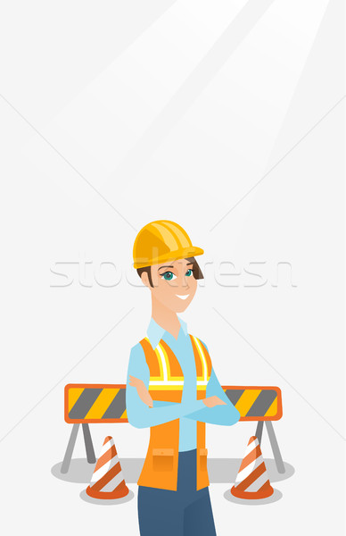 Confident builder with arms crossed. Stock photo © RAStudio