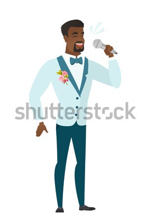 African-american groom holding a mobile phone. Stock photo © RAStudio
