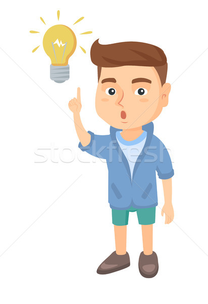Stock photo: Caucasian little boy pointing at the lightbulb.