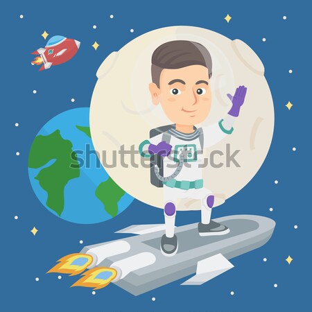 Caucasian kid spaceman with flag on a new planet. Stock photo © RAStudio