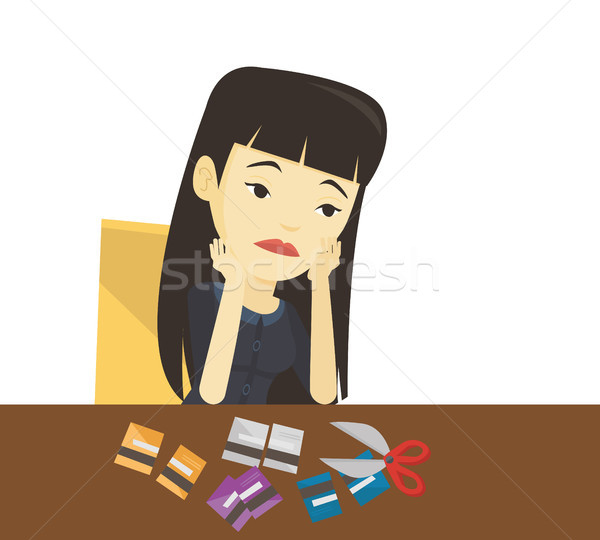 Business woman bankrupt cutting her plastic card. Stock photo © RAStudio