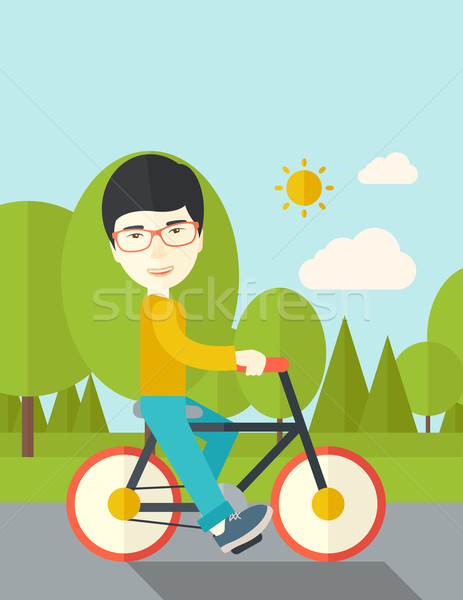 アジア 男 ライディング 自転車 公園 ベクトル ストックフォト © RAStudio
