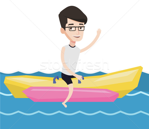 Tourists riding a banana boat vector illustration. Stock photo © RAStudio