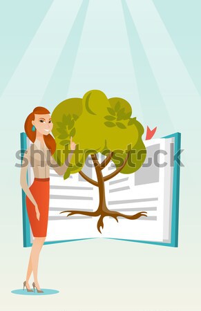 étudiant pointant arbre connaissances heureux Photo stock © RAStudio