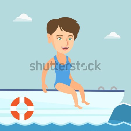 Young happy woman tanning on sailboat. Stock photo © RAStudio