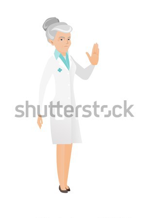 Senior caucasian doctor showing ok sign. Stock photo © RAStudio