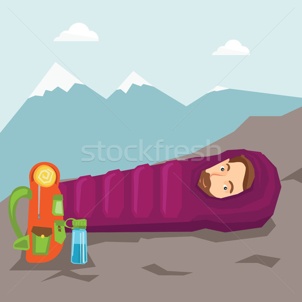 Man sleeping in sleeping bag in the mountains. Stock photo © RAStudio