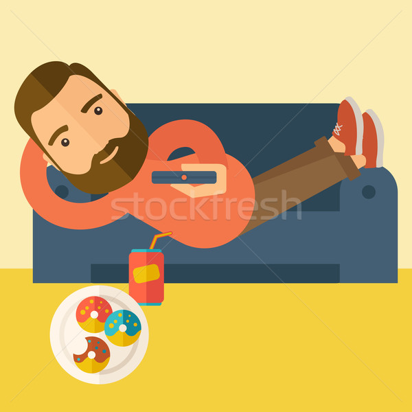 Człowiek sofa zdalnego trzy Zdjęcia stock © RAStudio