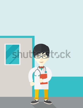 Jeunes médecin de sexe masculin permanent stéthoscope Homme [[stock_photo]] © RAStudio