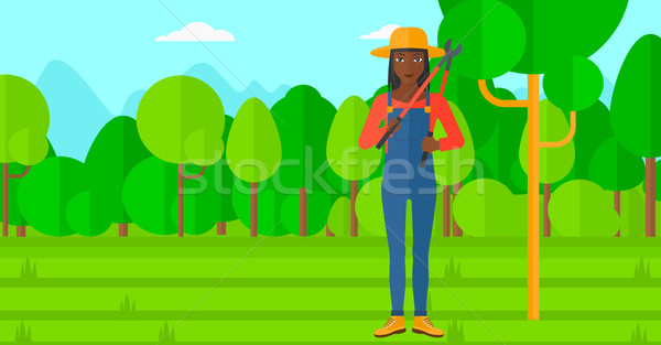 Farmer with pruner in garden. Stock photo © RAStudio