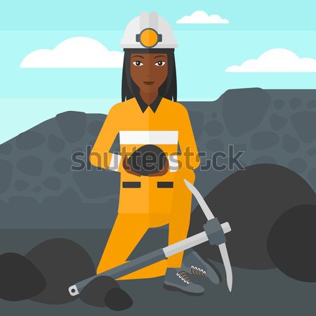 Miner holding coal in hands vector illustration. Stock photo © RAStudio