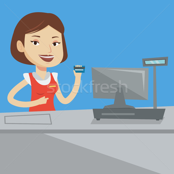 Cashier holding credit card at the checkout. Stock photo © RAStudio