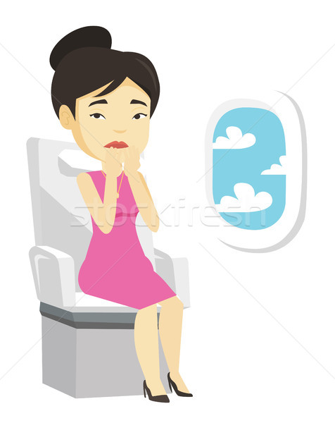 Young woman suffering from fear of flying. Stock photo © RAStudio