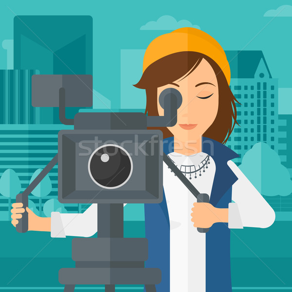 Camerawoman with movie camera on a tripod. Stock photo © RAStudio