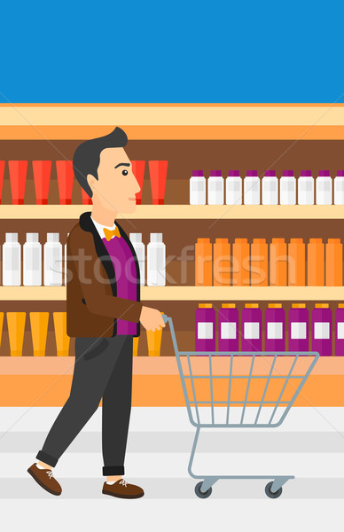 Client homme poussant vide supermarché panier [[stock_photo]] © RAStudio