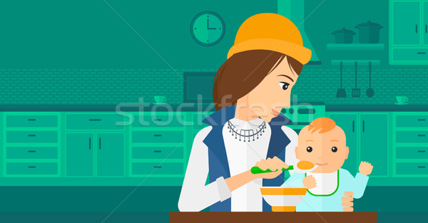 Woman feeding baby. Stock photo © RAStudio