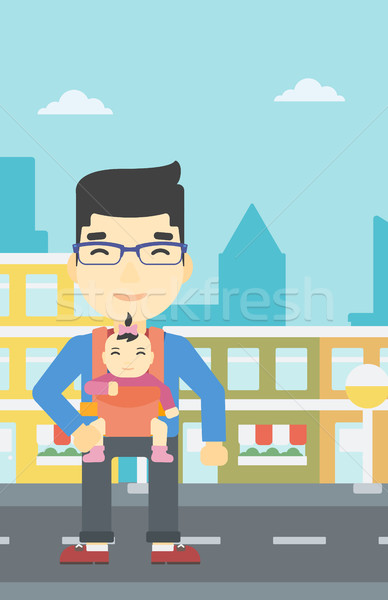 Father carrying his daughter in sling. Stock photo © RAStudio