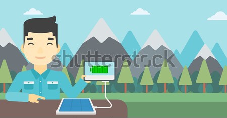 Solar panel charging tablet computer. Stock photo © RAStudio