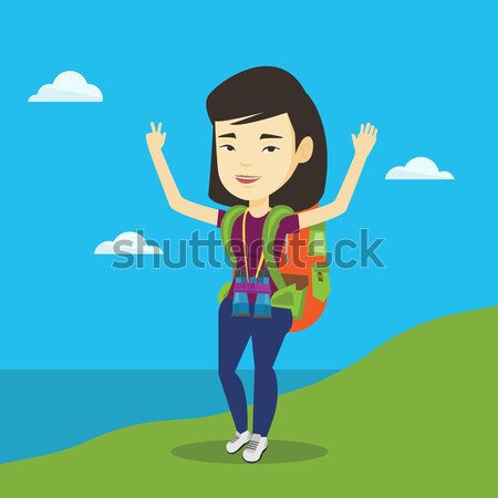 Backpacker with her hands up enjoying the scenery. Stock photo © RAStudio