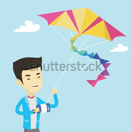 Young man flying kite vector illustration. Stock photo © RAStudio