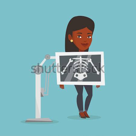 Pacjenta rentgenowskiego procedura młodych człowiek piersi Zdjęcia stock © RAStudio