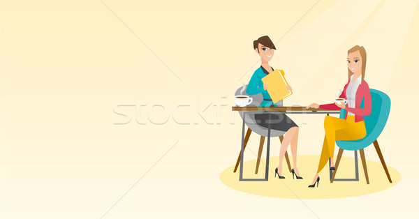 Two businesswomen during business meeting. Stock photo © RAStudio