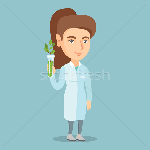 Scientist holding test tube with young sprout. Stock photo © RAStudio