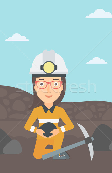 Miner holding coal in hands. Stock photo © RAStudio