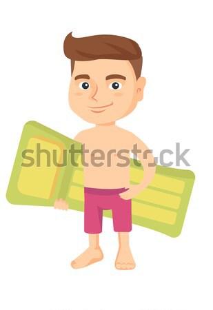 Little caucasian girl holding inflatable mattress. Stock photo © RAStudio