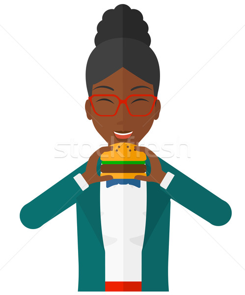 Woman eating hamburger.  Stock photo © RAStudio