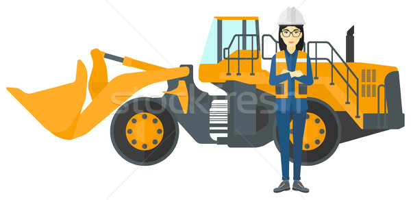 Stock photo: Miner with mining equipment on background.