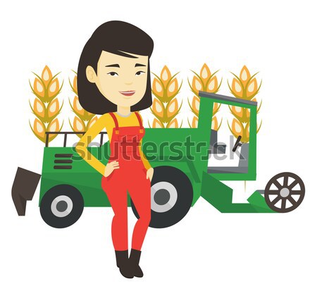 Farmer standing with combine on background. Stock photo © RAStudio