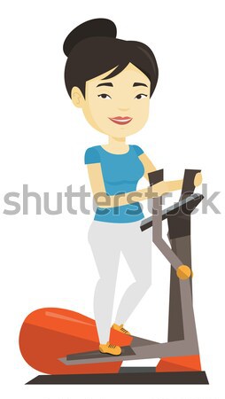 Man exercising on elliptical trainer. Stock photo © RAStudio